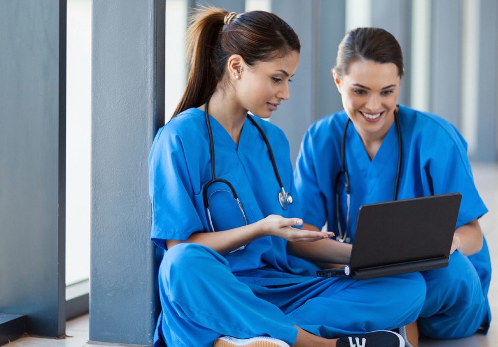 Nurses looking at laptop