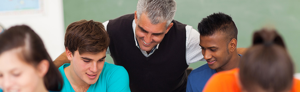 Teacher helping students